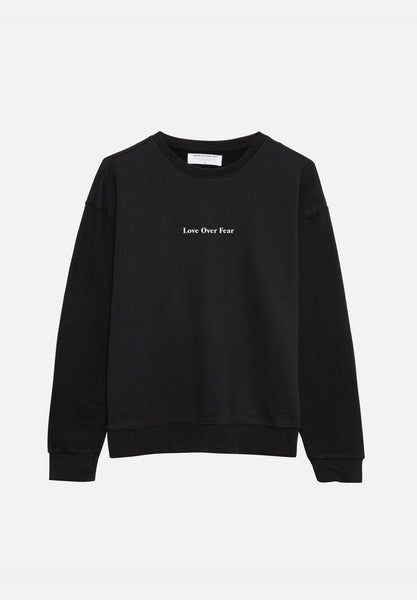 Sweater with love new arrivals written on it