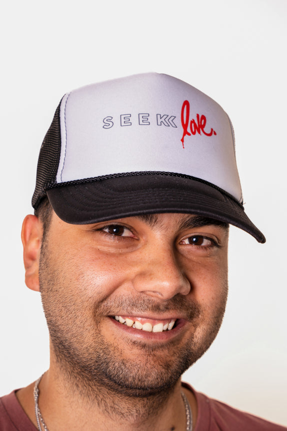 Seek Love Trucker Hat