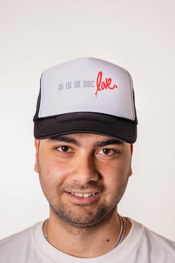 Seek Love Trucker Hat
